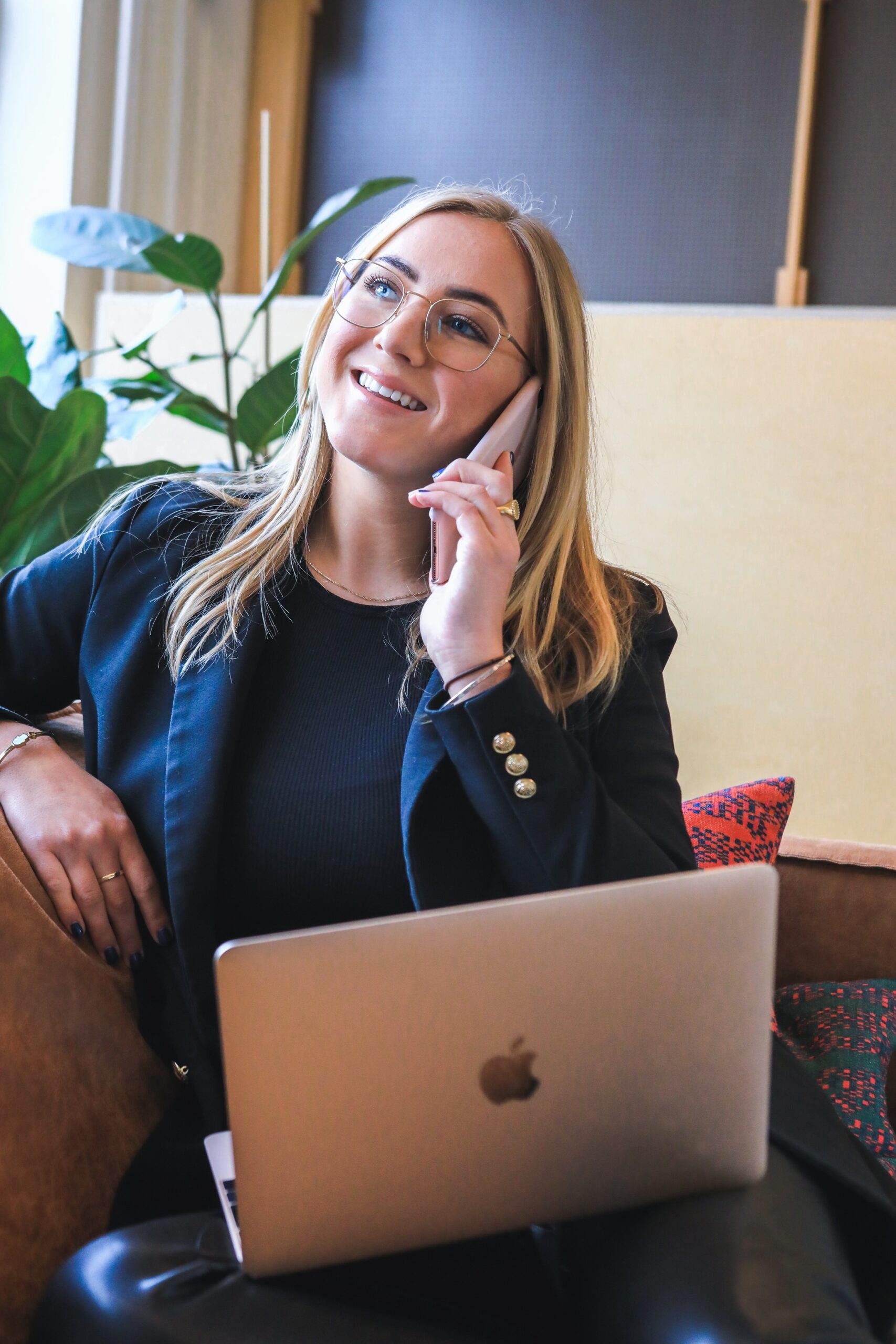 Woman on phone and laptop. Woman on phone and laptop.